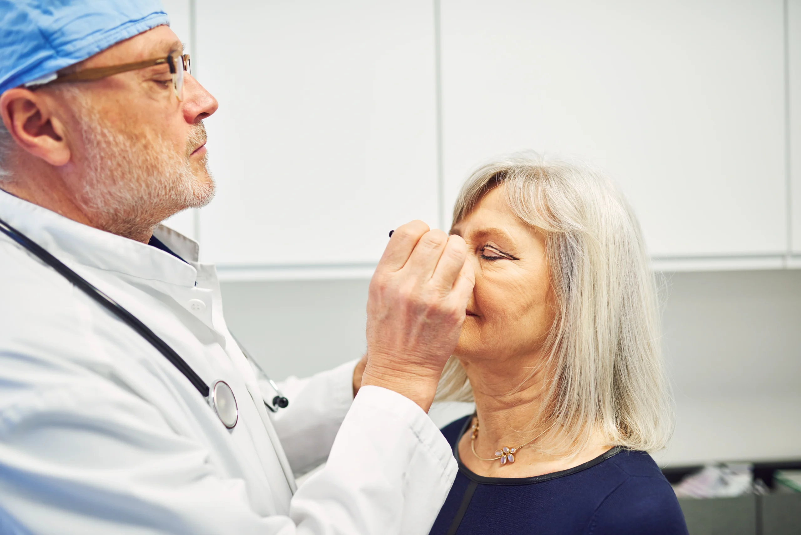 Patient consultation for upper and lower eyelid surgery at a CQC-registered hospital in London